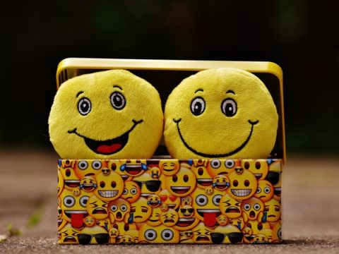 Two Yellow smiley faces laughing