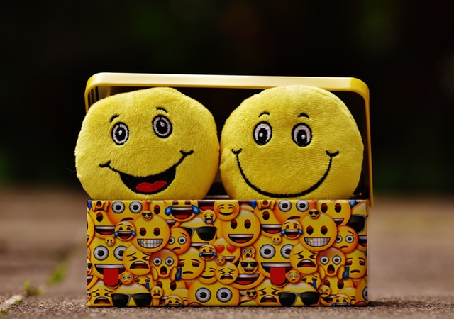 Two Yellow smiley faces laughing